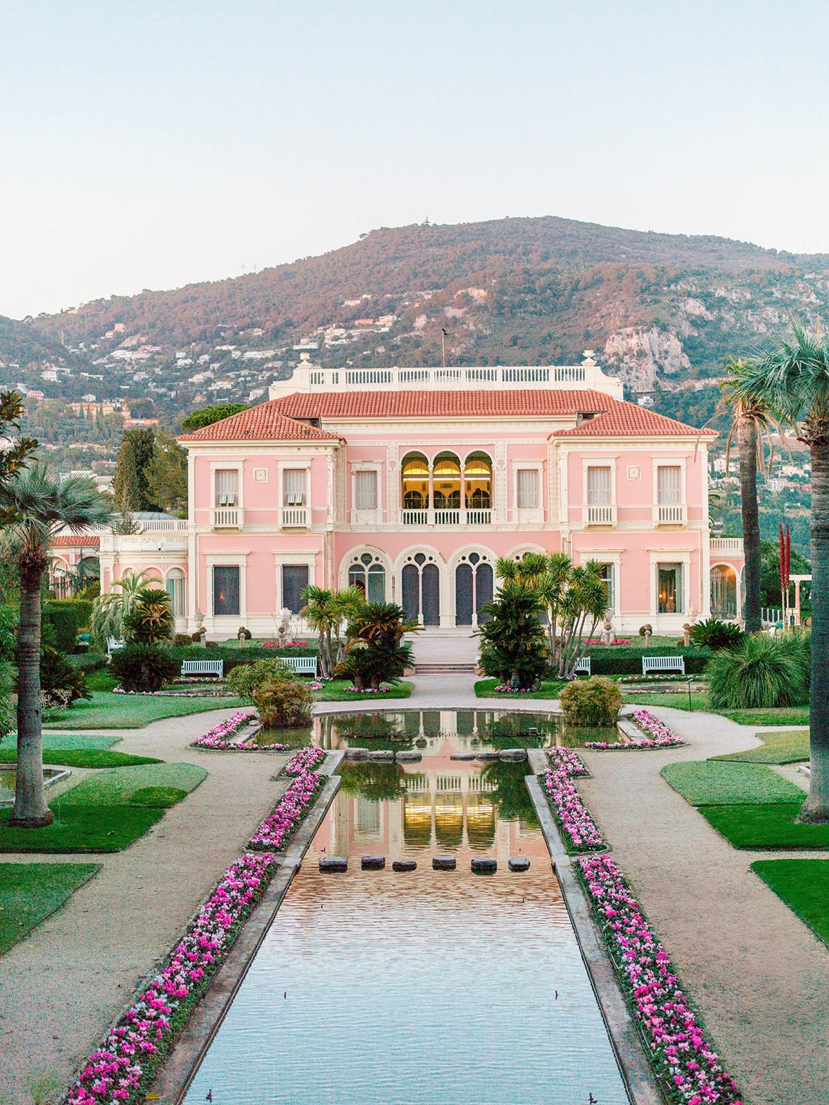 Wide view across the French garden, pools and pink villa in Saint-Jean-Cap-Ferrat